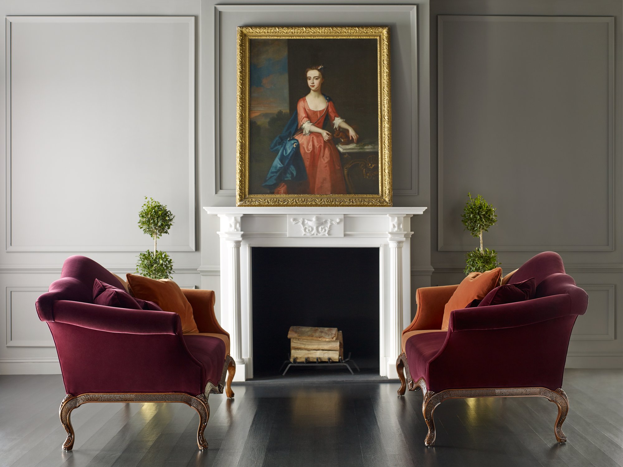 Baker burgundy seating in a classical salon