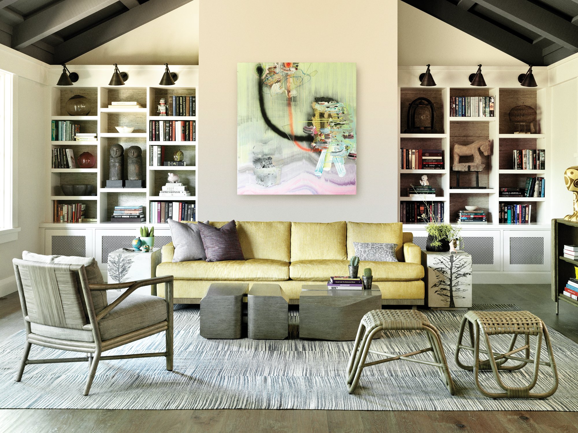 Eclectic McGuire living room with a yellow sofa and woven furniture
