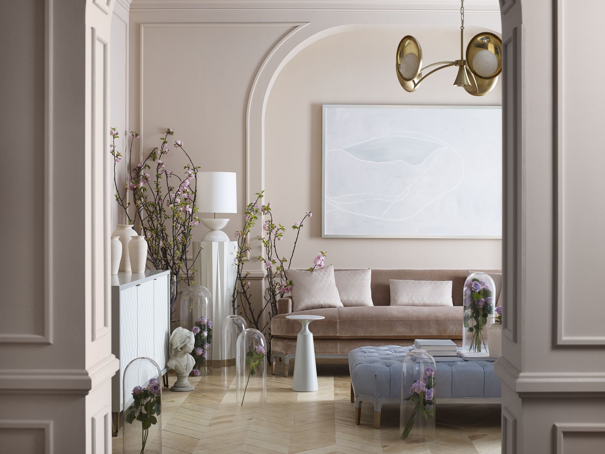 Baker pale living room framed by elegant arches